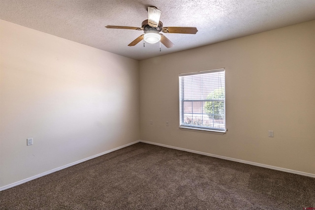 carpeted empty room featuring ceiling fan and a textured ceiling