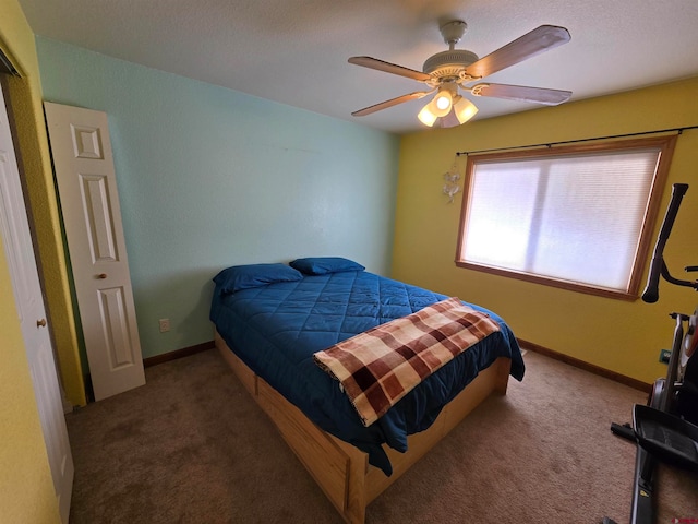 bedroom with dark carpet and ceiling fan