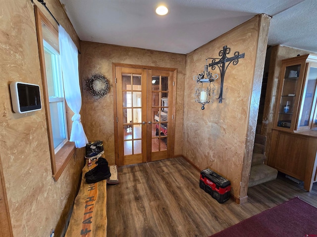 doorway with dark hardwood / wood-style flooring and french doors