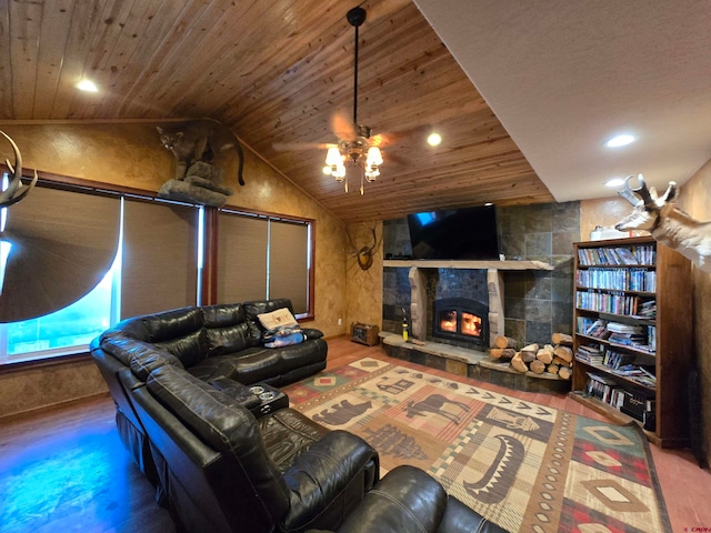 living room featuring hardwood / wood-style floors, lofted ceiling, a tile fireplace, and wooden ceiling