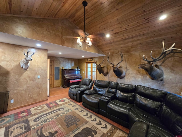 cinema room with ceiling fan, french doors, wooden ceiling, hardwood / wood-style floors, and vaulted ceiling