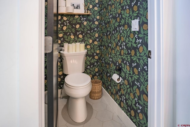 bathroom featuring tile patterned floors and toilet