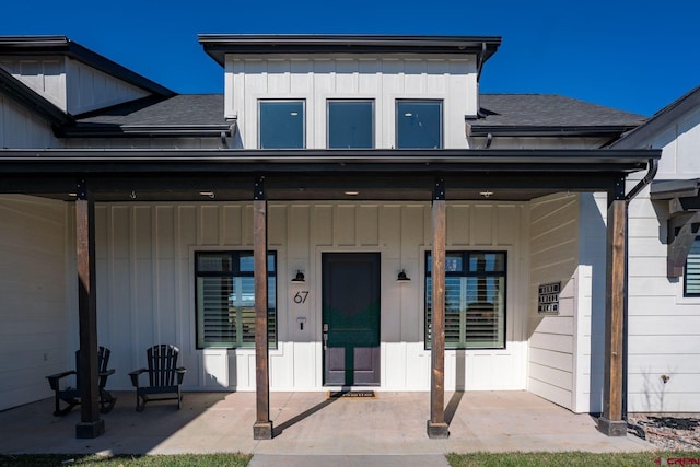 property entrance featuring covered porch