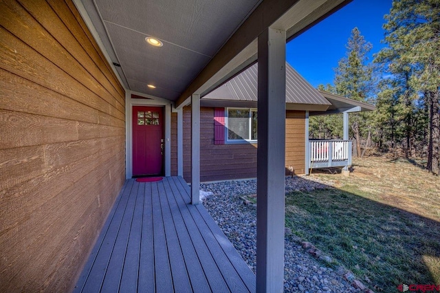 view of exterior entry featuring a yard