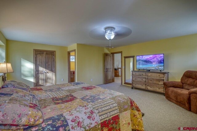 bedroom featuring light carpet and ceiling fan