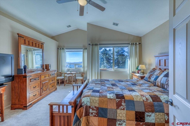 carpeted bedroom featuring ceiling fan and vaulted ceiling