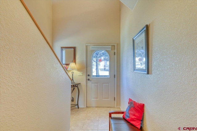 foyer entrance featuring light tile patterned floors