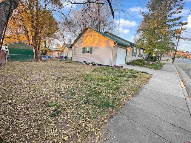 view of property exterior featuring a garage