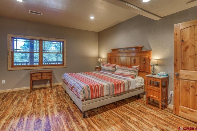 bedroom featuring hardwood / wood-style floors