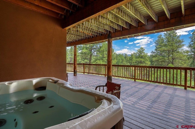 wooden terrace with a hot tub