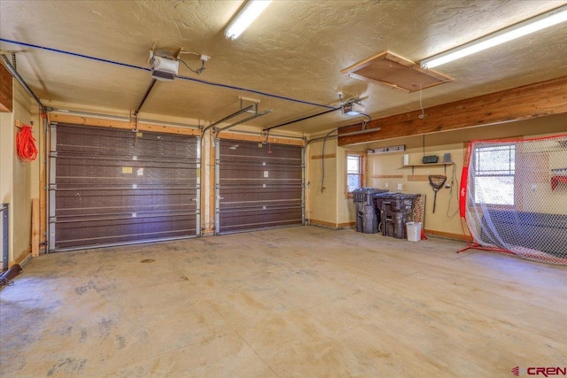 garage featuring a garage door opener