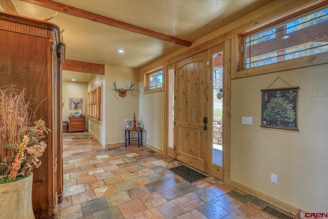 entrance foyer with beamed ceiling