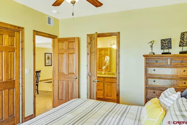 bedroom featuring carpet, connected bathroom, and ceiling fan