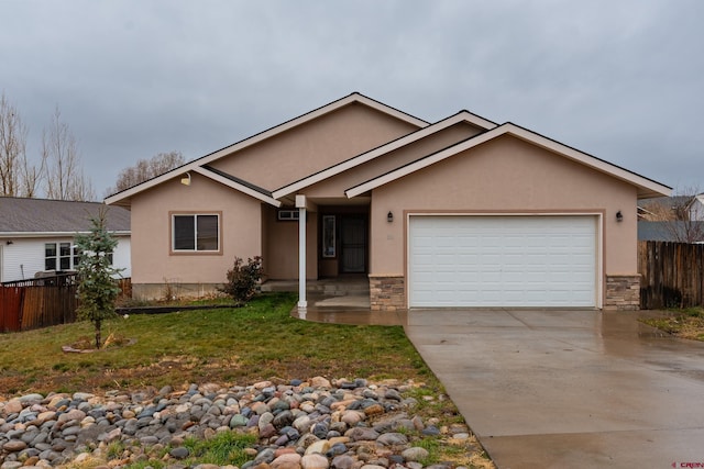 ranch-style house featuring a front yard and a garage