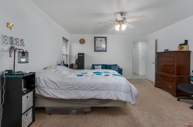 bedroom featuring light carpet and ceiling fan