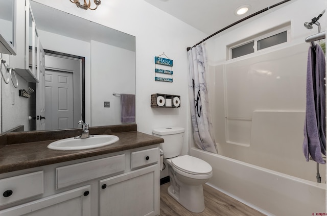 full bathroom with wood-type flooring, vanity, toilet, and shower / bathtub combination with curtain