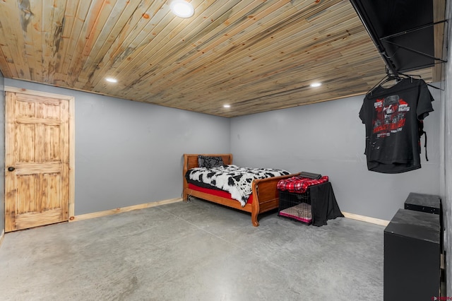 bedroom with concrete floors and wooden ceiling