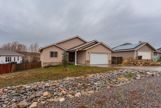 ranch-style house featuring a garage