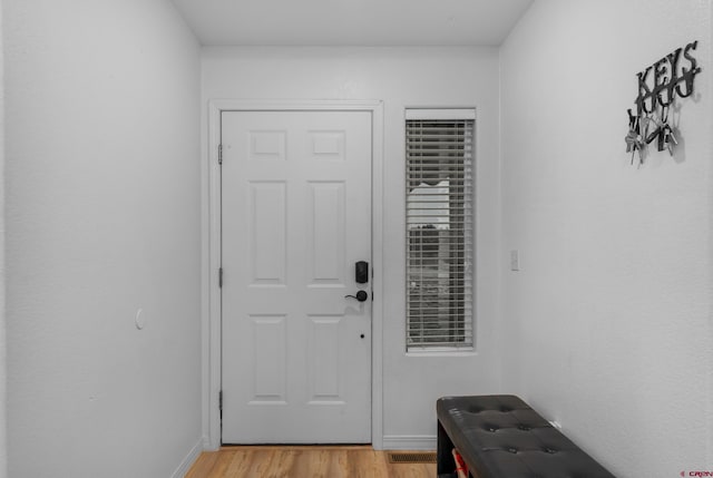 doorway to outside featuring light wood-type flooring