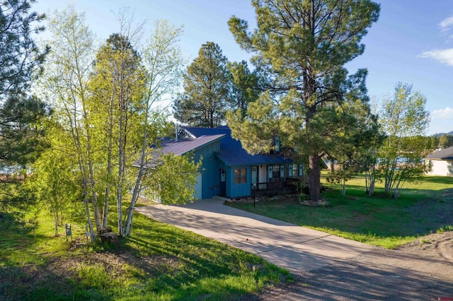 obstructed view of property featuring a front yard