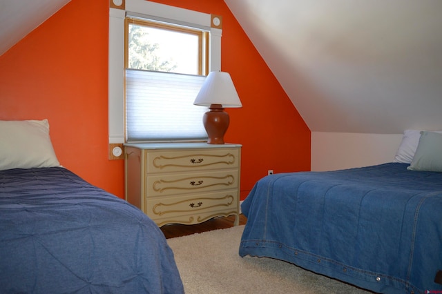 bedroom featuring carpet flooring and vaulted ceiling