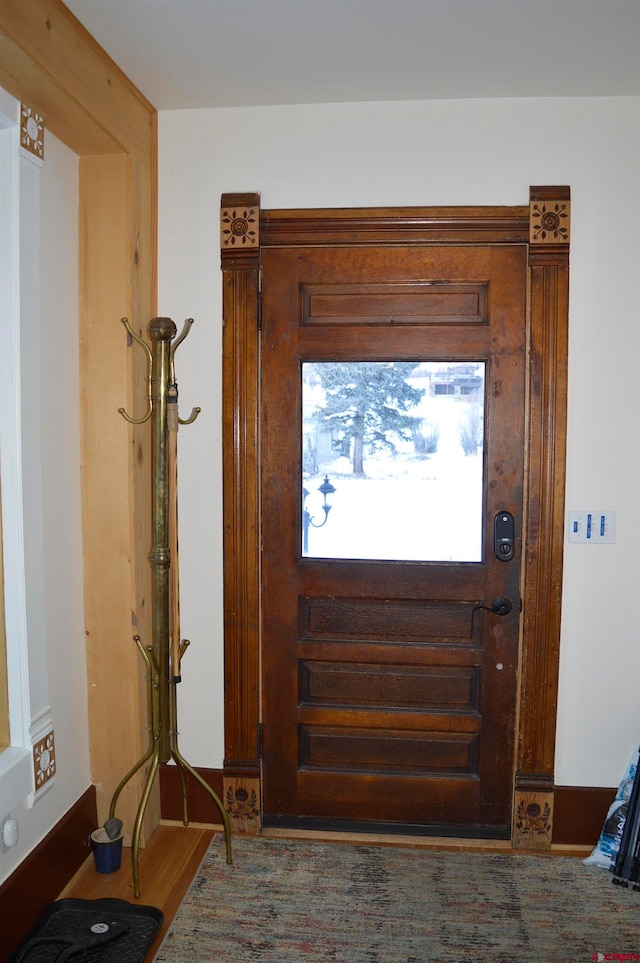 entryway with wood-type flooring