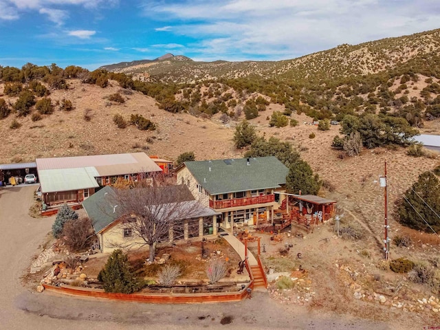 birds eye view of property featuring a mountain view