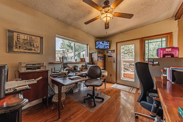 office space with ceiling fan, plenty of natural light, a textured ceiling, and hardwood / wood-style flooring