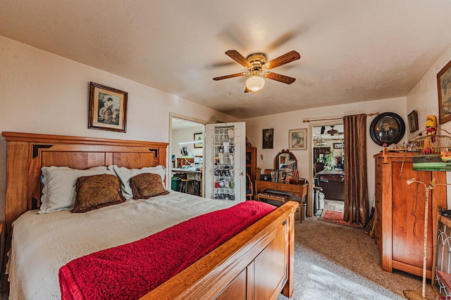 bedroom featuring light colored carpet and ceiling fan