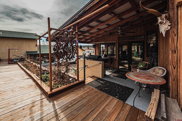 wooden terrace featuring ceiling fan