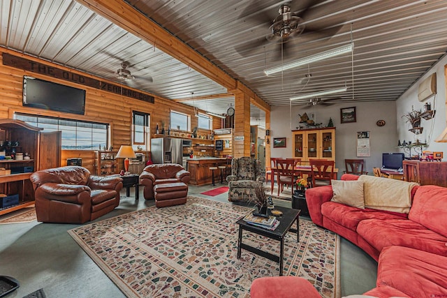 living room with a wall unit AC, wooden walls, and concrete floors