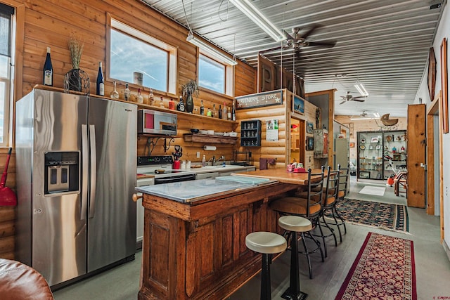 kitchen featuring ceiling fan, sink, and appliances with stainless steel finishes