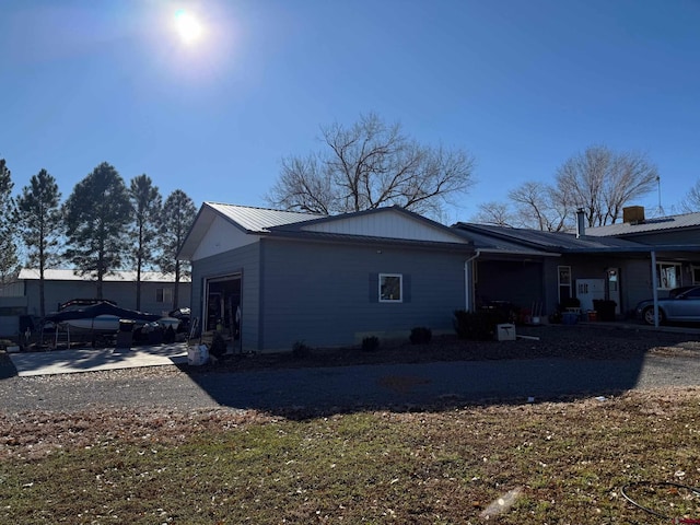 view of side of home featuring a garage