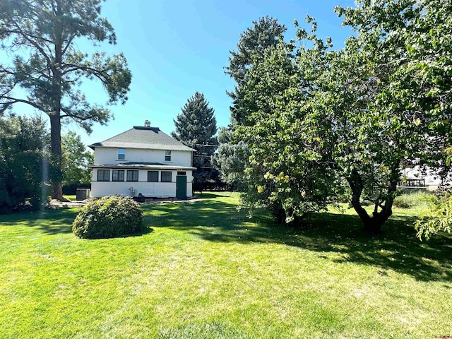 view of yard featuring a sunroom