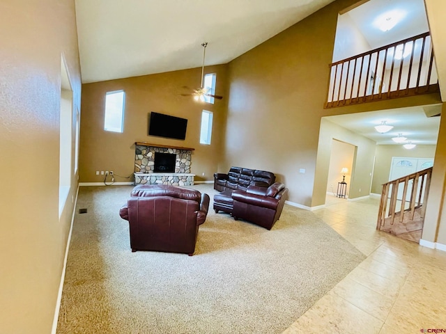 living room featuring carpet, ceiling fan, a fireplace, and high vaulted ceiling