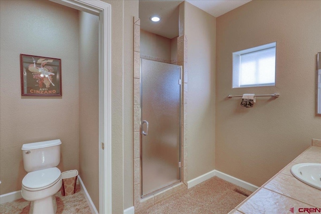 bathroom with walk in shower, tile patterned floors, vanity, and toilet