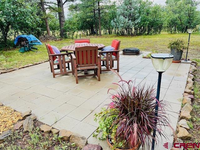 view of patio featuring a fire pit