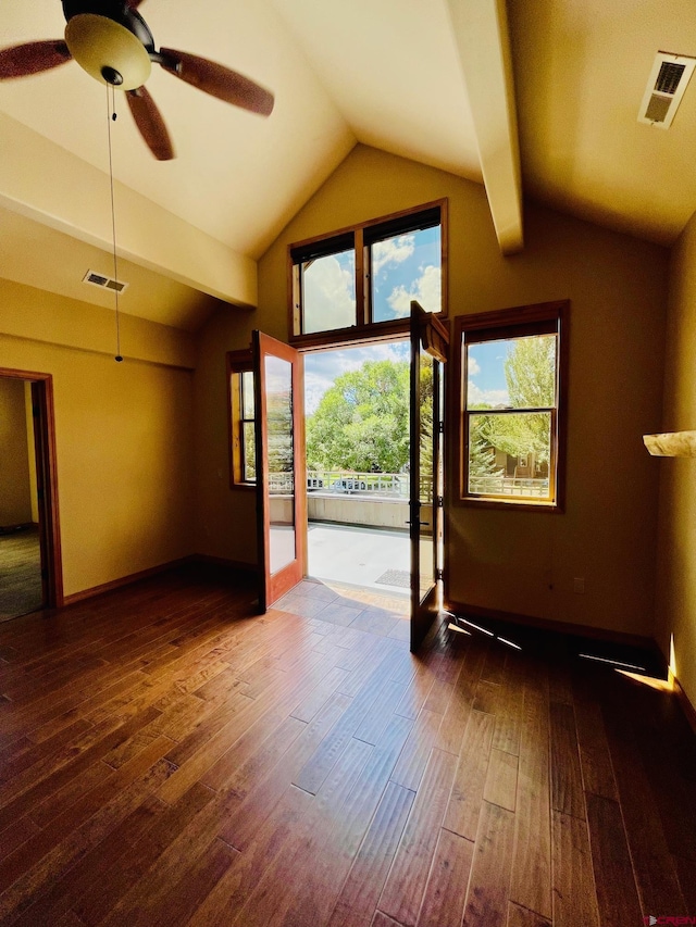 interior space featuring lofted ceiling with beams, ceiling fan, and dark hardwood / wood-style flooring