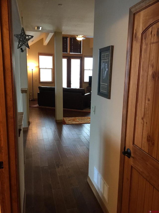 corridor featuring dark wood-type flooring