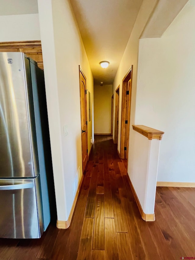 corridor featuring dark hardwood / wood-style flooring