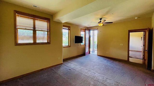 unfurnished room with carpet and ceiling fan