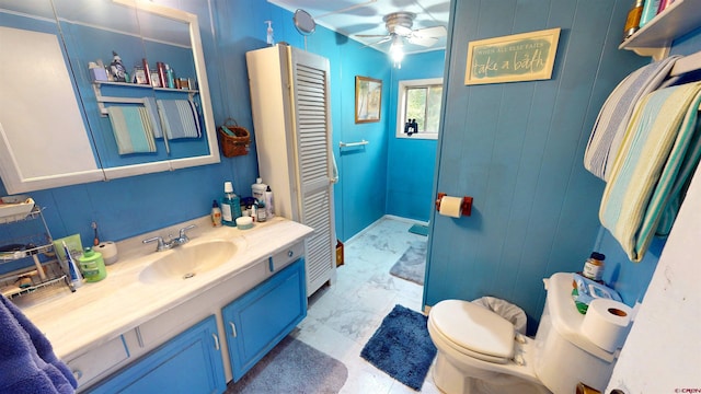 bathroom with ceiling fan, vanity, and toilet