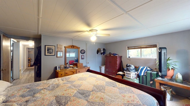 bedroom with ceiling fan and light hardwood / wood-style floors