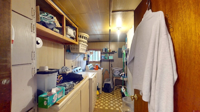 kitchen with cream cabinets and washing machine and clothes dryer