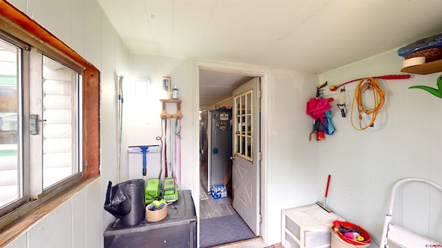 interior space with wooden walls and hardwood / wood-style flooring