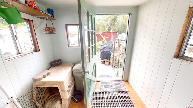 doorway with wooden walls