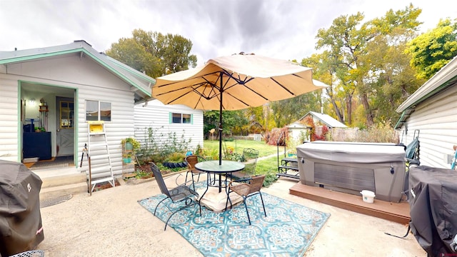 view of patio featuring a hot tub and grilling area