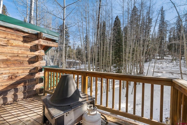 view of snow covered deck