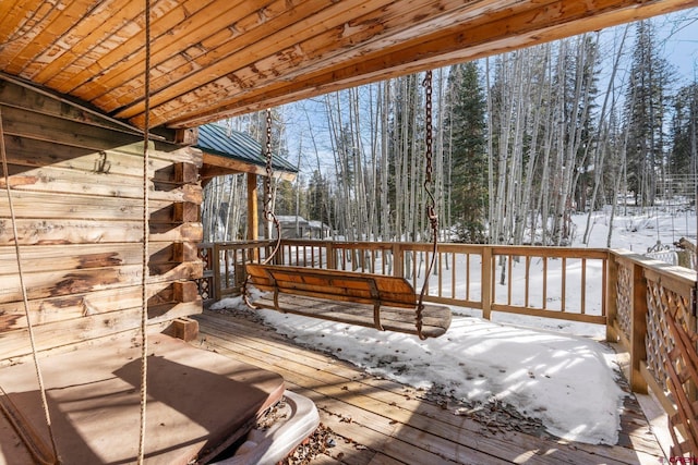 view of snow covered deck