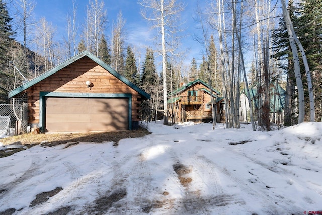 exterior space featuring an outbuilding and a garage